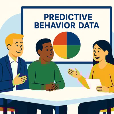 A diverse group of consultants sit around a table discussing predictive behavior data, while a presentation screen behind them shows a simple four-quadrant color chart symbolizing behavioral insights.