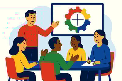 A coach presents a circular diagram backed by a MyHardWired four-quadrant gear in red, yellow, green, and blue while a diverse group of team members sits around a table, discussing how different motivations shape behavior.