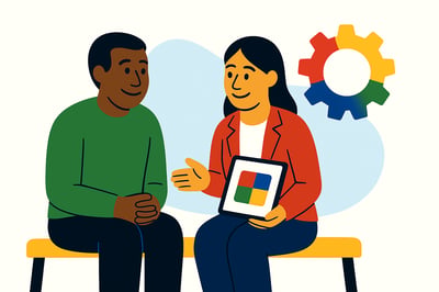 Two coworkers sit calmly together, discussing behavioral insight shown on a tablet. Their expressions suggest mutual understanding. A MyHardWired gear and soft blue background shape complete the reset-focused scene.
